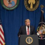 President Donald Trump speaks to troops while visiting
