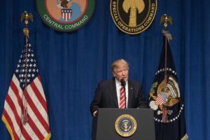 President Donald Trump speaks to troops while visiting