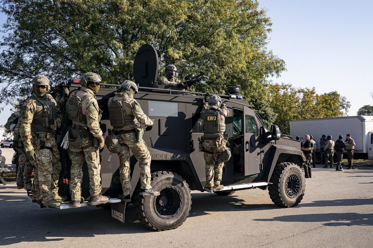 For More Sports And Politics Content: Secretary of Homeland Security Kristi Noem, not shown, visits with U.S. Immigration and Customs Enforcement officers at the ICE facility in Chicago to observe enforcement operations, Oct. 3, 2025. (DHS photo by Tia Dufour)