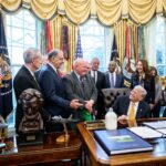 English: President Donald Trump signs Executive Orders including the “Whole Milk for Healthy Kids Act" alongside HHS Secretary Robert F. Kennedy, Jr., Secretary of Agriculture Brooke Rollins, and dairy farmers in the Oval Office, Wednesday, January 14, 2026. (Official White House Photo by Joyce N. Boghosian)