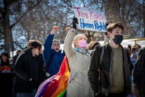 escription Students at Central Academy walked out of school over the noon hour and marched to the Governor's mansion to protest a new anti-transgender law. Conservative officials in Iowa have joined other states in enacting laws to prevent transgender students from competing in sports. Date 11 March 2022, 13:17 Source Students Protest Anti-Trans Law Author Phil Roeder from Des Moines, IA, USA